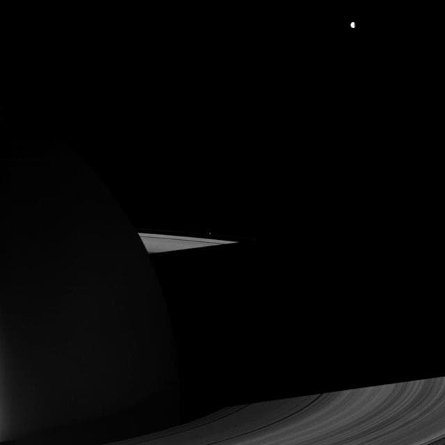 NASA image: Dione and the Dark Side