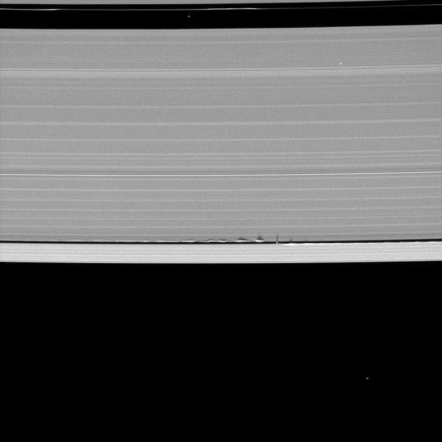 NASA image: Tiny Moon, Looming Shadows
