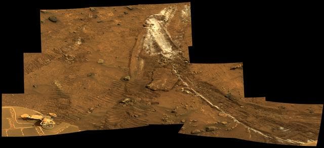 NASA image: Rover Wheel Churns Up Bright Martian Soil