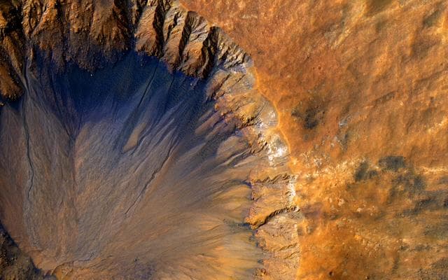 NASA image: A Fresh Crater near Sirenum Fossae