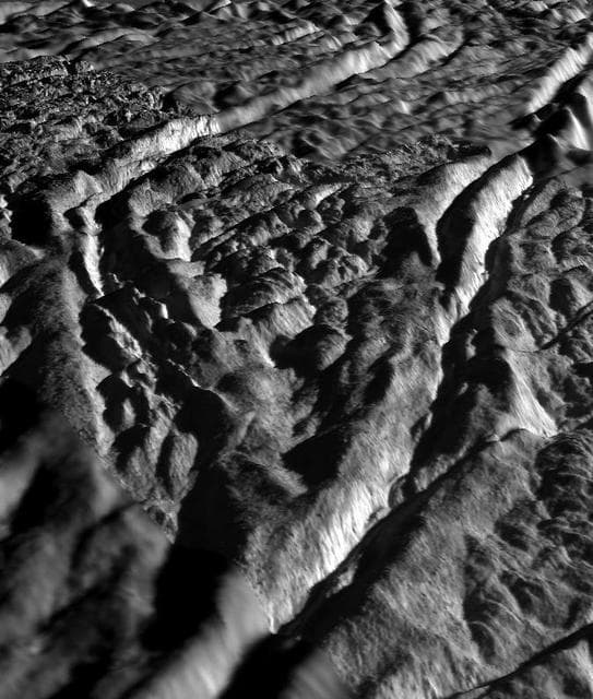 NASA image: Perspective view of Baghdad Sulcus, Enceladus
