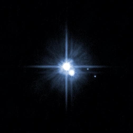 NASA image: Pluto and its Moons: Charon, Nix, and Hydra