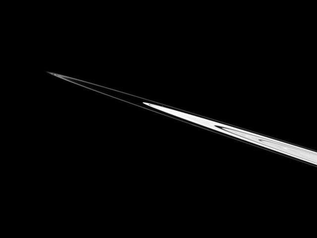 NASA image: Speck Between Rings