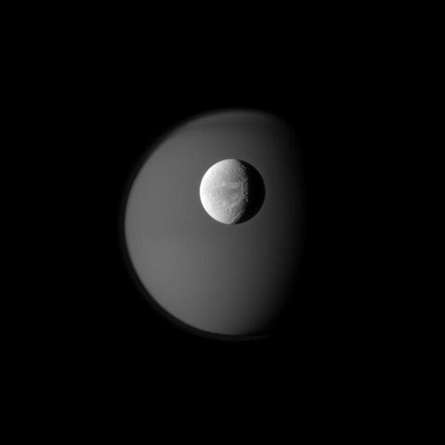 NASA image: Dione and Ghostly Titan