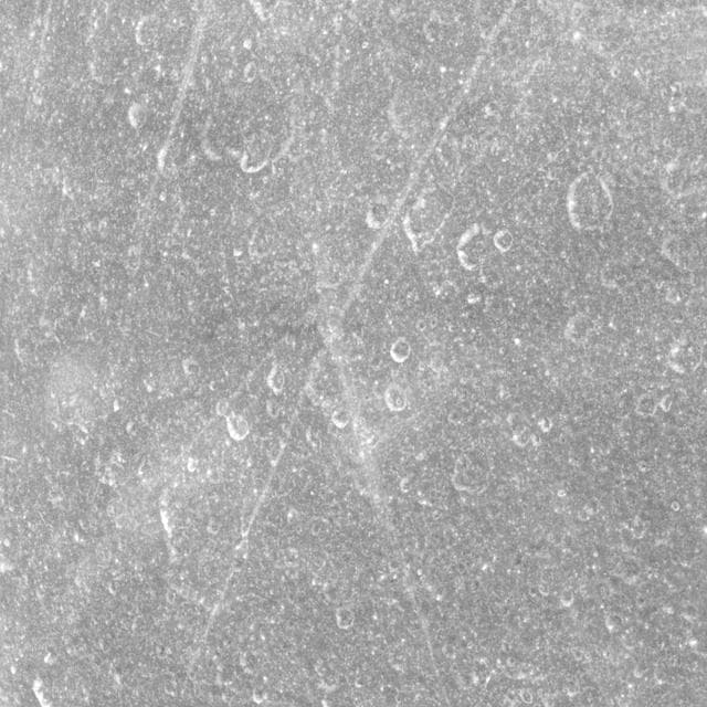 NASA image: Crisscrossing Rhea