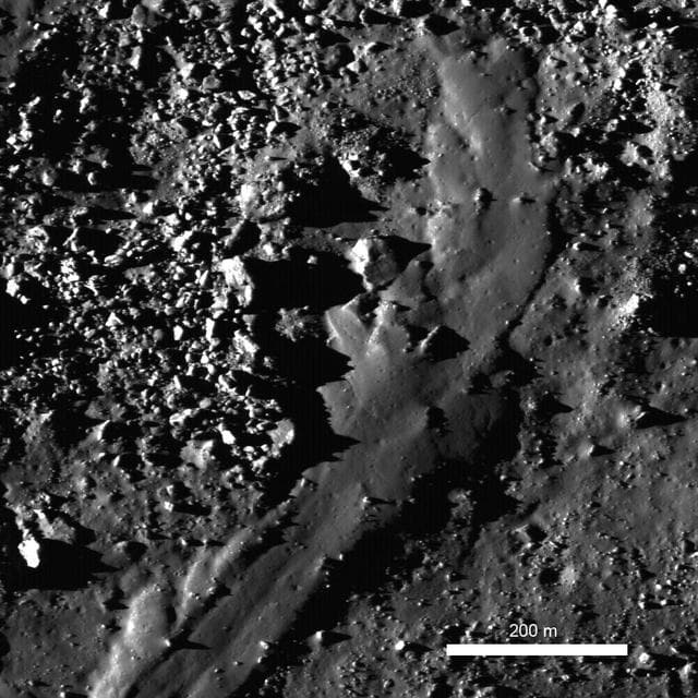 NASA image: Out of the Shadows: Impact Melt Flow at Byrgius A Crater
