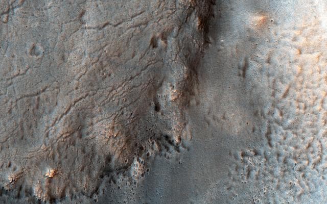 NASA image: Smooth and Fractured Deposits in Eridania Valleys