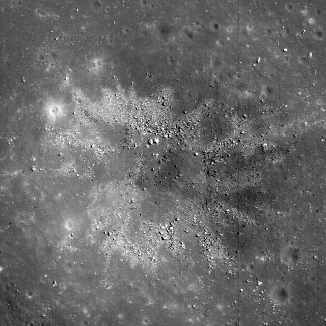 NASA image: Two-toned Impact Crater in Balmer Basin: A Reflection of the Target?