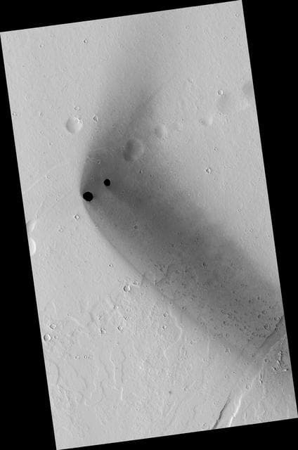 NASA image: Dark Rimless Pits in the Tharsis Region