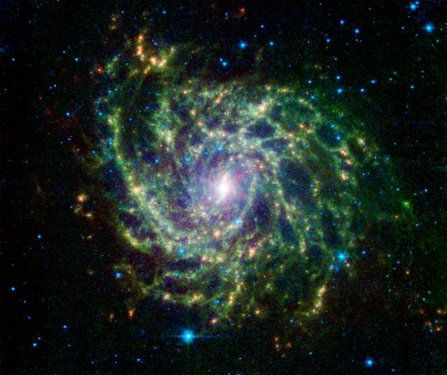 NASA image: A Twisted Star-Forming Web in the Galaxy IC 342
