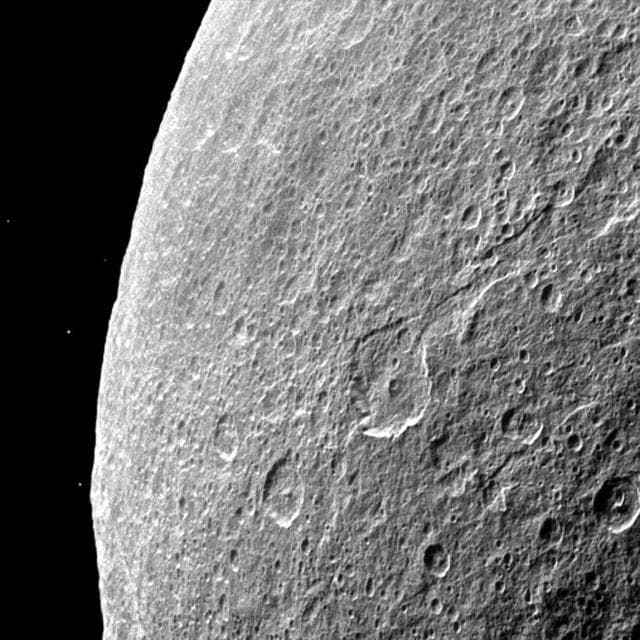 NASA image: Rhea Lit at Night