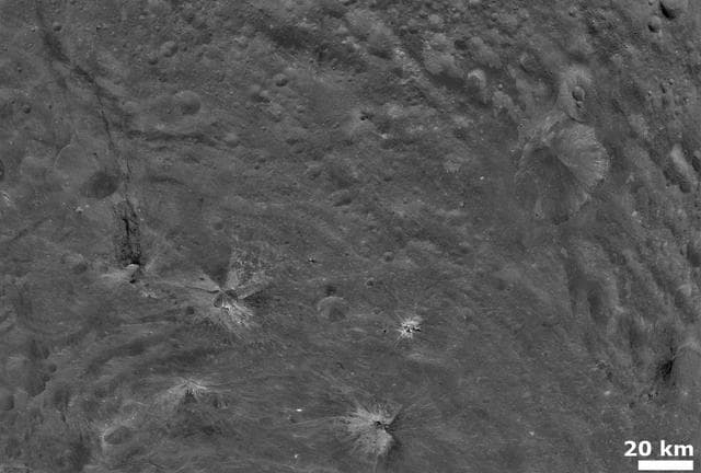 NASA image: Bright and Dark Material on Vesta Surface
