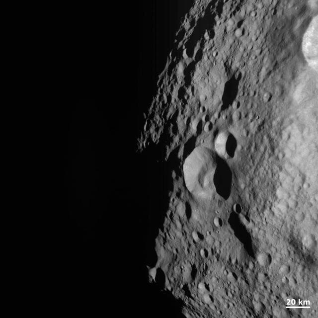 NASA image: Young and Old Crater at the Night and Day Boundary on Vesta