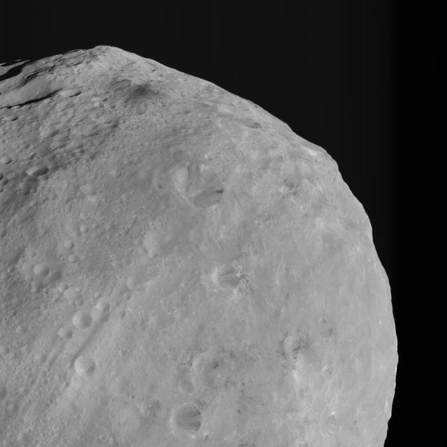 NASA image: Mountains and Bright and Dark Material on Vesta