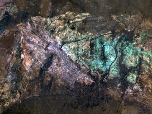 NASA image: Colorful Central Peak in an Unnamed Crater