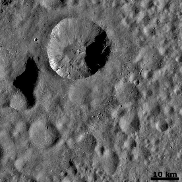 NASA image: Ejecta from a Fresh Crater Covering Older Craters and Crater Chains