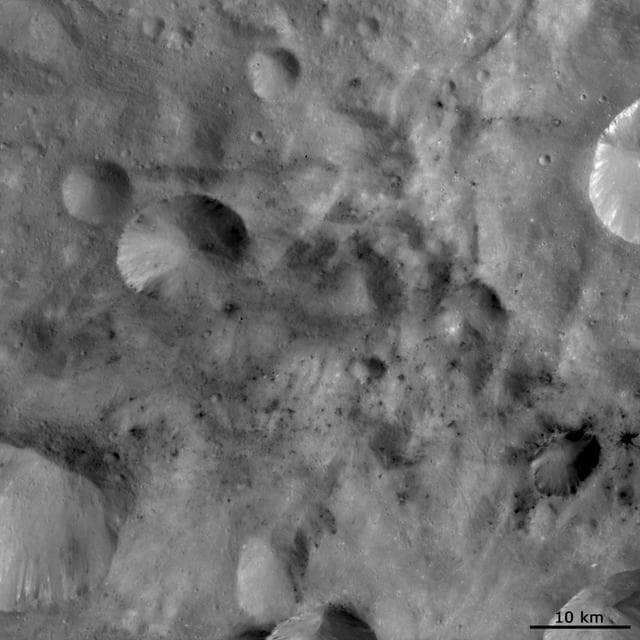 NASA image: Dark Material Associated with and between Craters