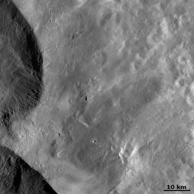 NASA image: Ejecta from Vesta Snowman Craters