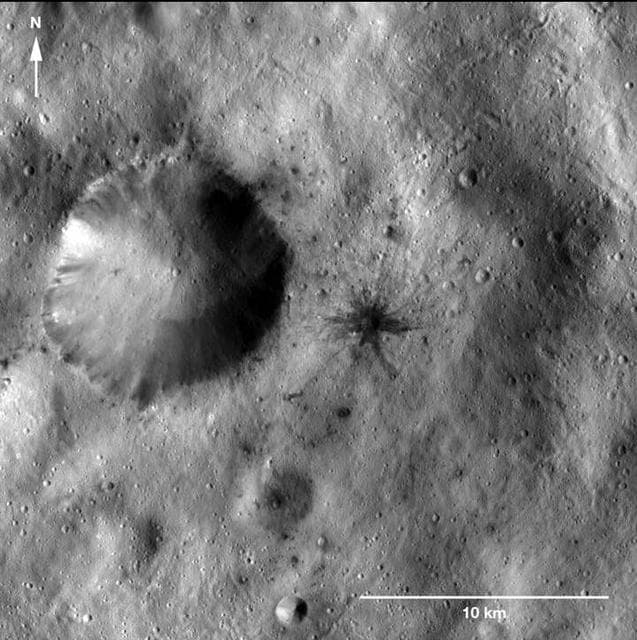 NASA image: Dark-Rayed Crater and Spots