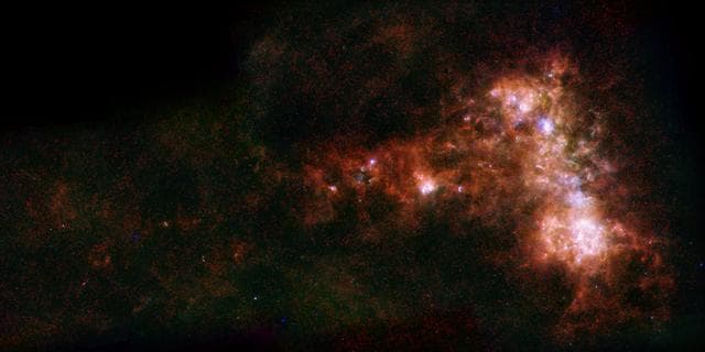 NASA image: A Dwarf Galaxy Star Bar and Dusty Wing