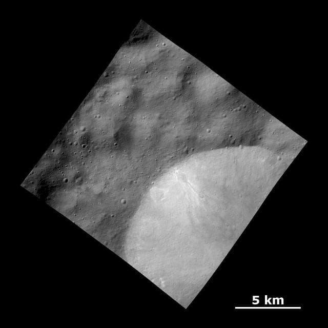 NASA image: Bright Material Deposits in Crater Wall