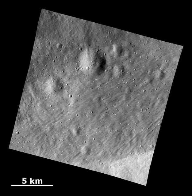 NASA image: Smooth Ejecta with Grooved Surface Showing Buried Craters