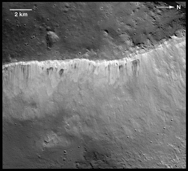 NASA image: Bright and Dark at West Rim of Marcia Crater