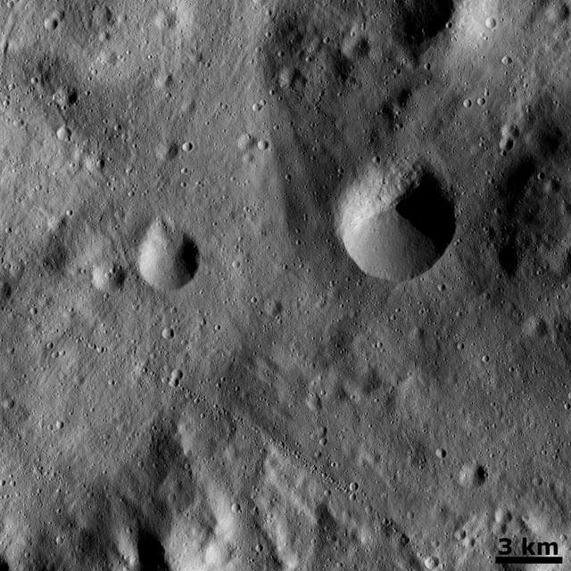NASA image: Curved Chain of Small Craters
