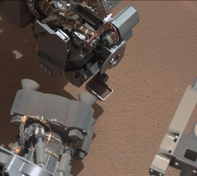 NASA image: View of Curiosity First Scoop Also Shows Bright Object