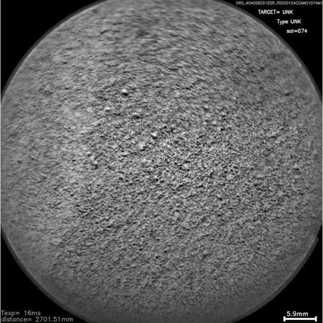 NASA image: Laser Hit on Martian Sand Target, Before and After