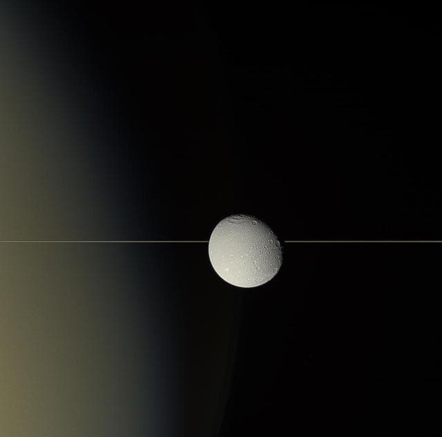 NASA image: Dione on the Edge