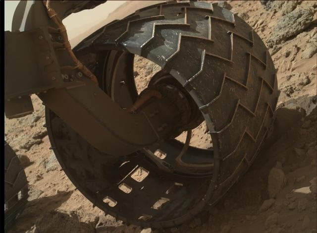 NASA image: Left-Front Wheel of Curiosity Rover, Approaching Three Miles