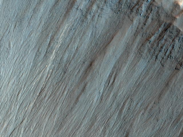 NASA image: Bright Tracks from Bouncing and Rolling Boulders