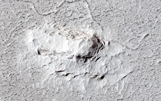 NASA image: Which Came First, the Yardang or the Platy Flow?