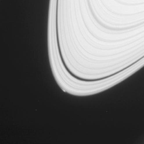NASA image: Commotion at Ring Edge May Be Effect of Small Icy Object