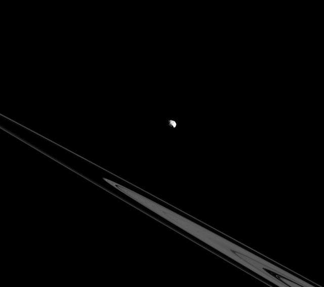 NASA image: Epimetheus Above the Rings