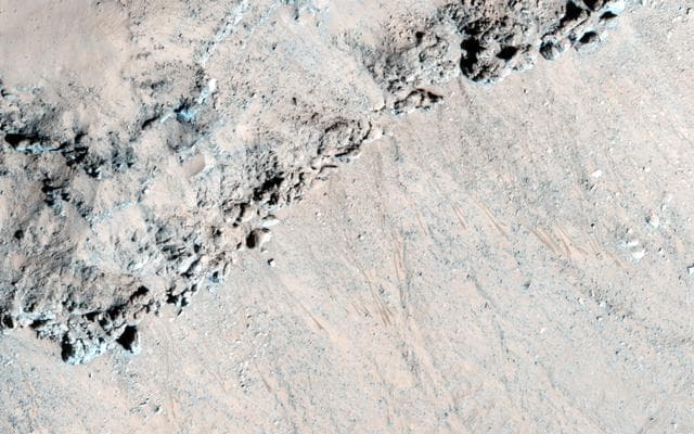 NASA image: Seasonal Flows in Asimov Crater