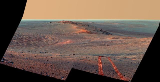 NASA image: Rover Tracks in Northward View Along West Rim of Endeavour, False Color