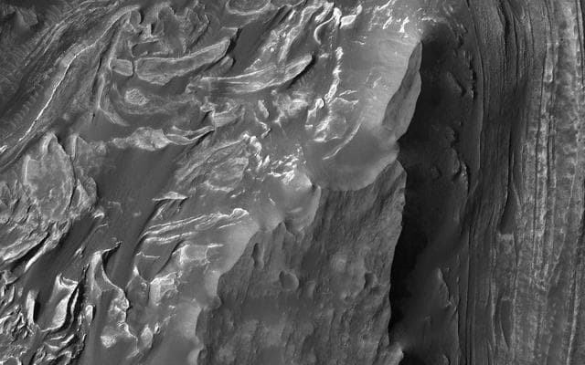 NASA image: Mounds of Layered Material on the West Edge of Melas Chasma