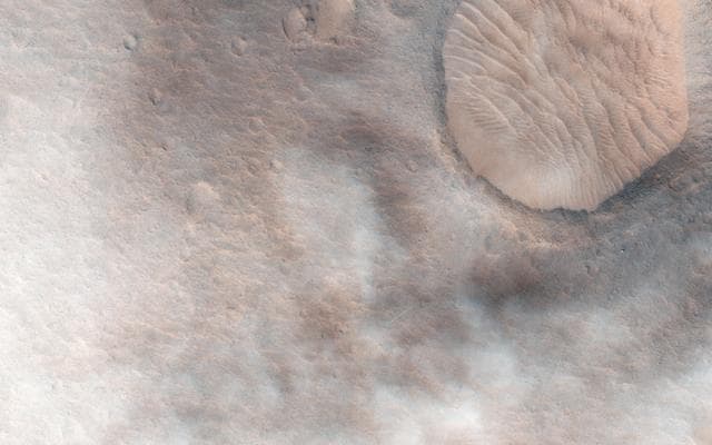 NASA image: Cloudy Skies over Hypanis Vallis