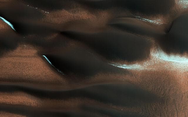NASA image: Aeolian Features of Scandia Cavi