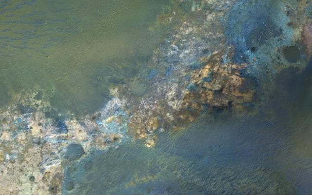 NASA image: Colorful Bedrock in the Central Uplift of an Impact Crater