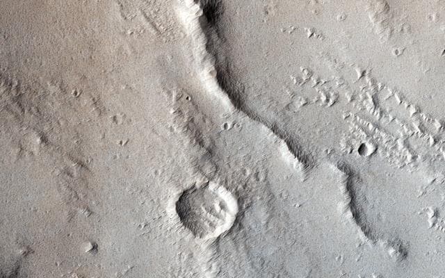 NASA image: Wrinkle Ridges and Pit Craters
