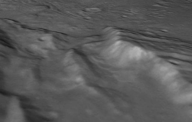 NASA image: Landslides in a Charon Chasm