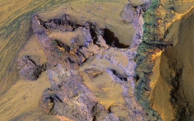 NASA image: Colorful Bedrock Exposed in a Landslide Scarp