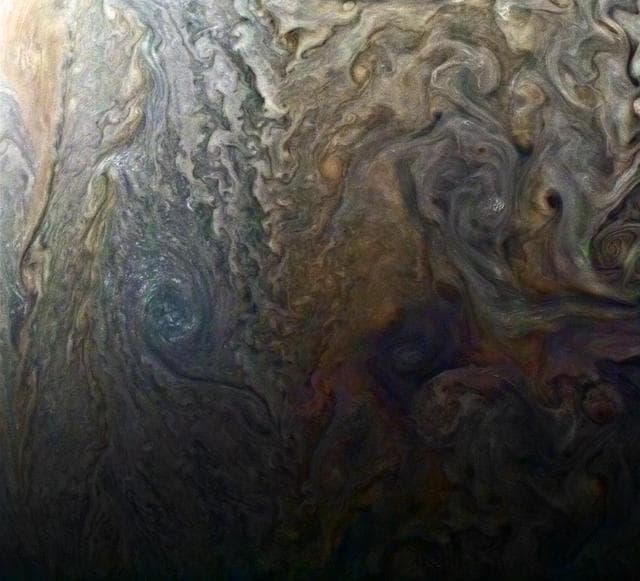 NASA image: Dark Spot and Jovian Galaxy