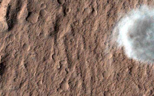 NASA image: A Dust Devil on Hilly Terrain