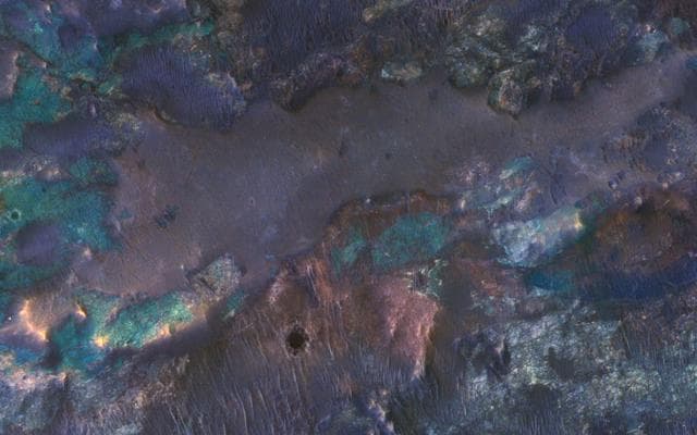 NASA image: Colorful Impact Ejecta from Hargraves Crater