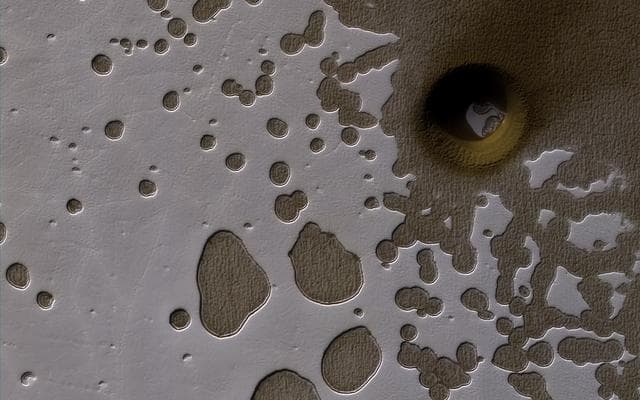 NASA image: A South Polar Pit or an Impact Crater?