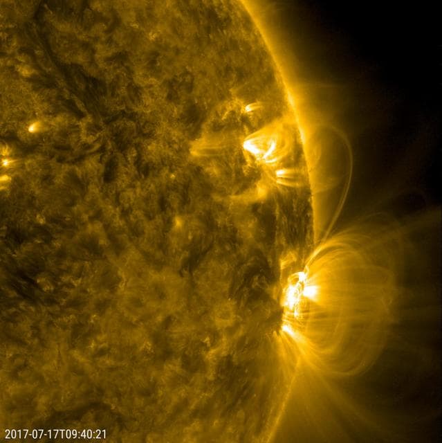 NASA image: Kinked Loop Stretching Between Two Active Regions